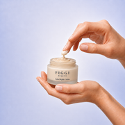 Hands holding FIGGI Luxe Night Crème jar for an evening Green Rooibos skincare ritual